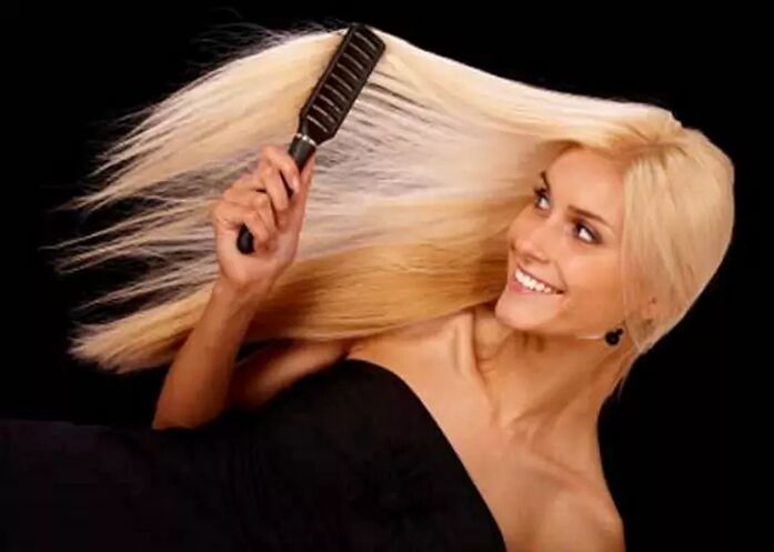 Girl combing her hair