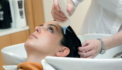 The master applies the product as he goes through the hair